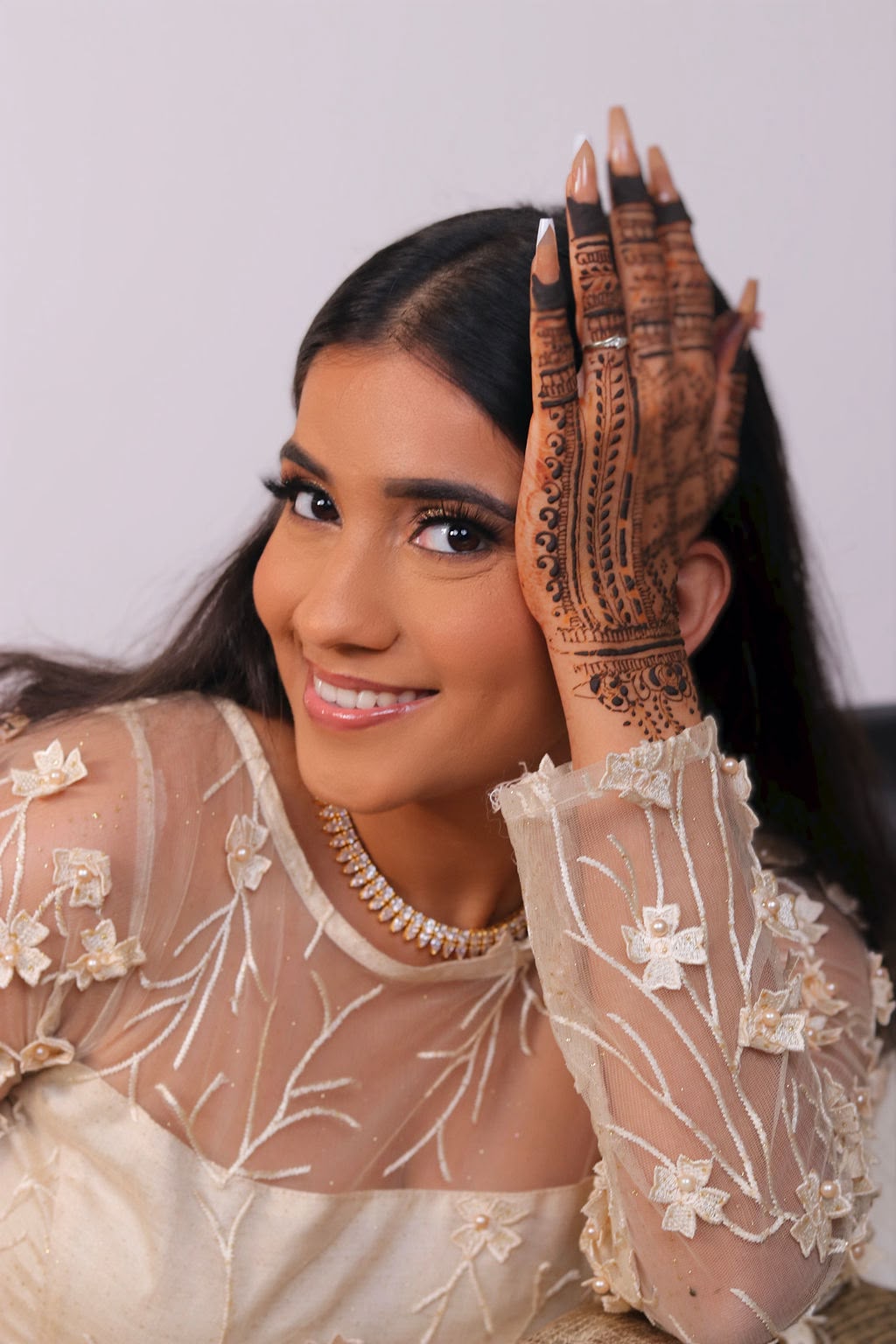 Janvi wearing intricate bridal henna on her hands